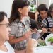 Happy family having breakfast together at home, sharing joyful moments and healthy food.